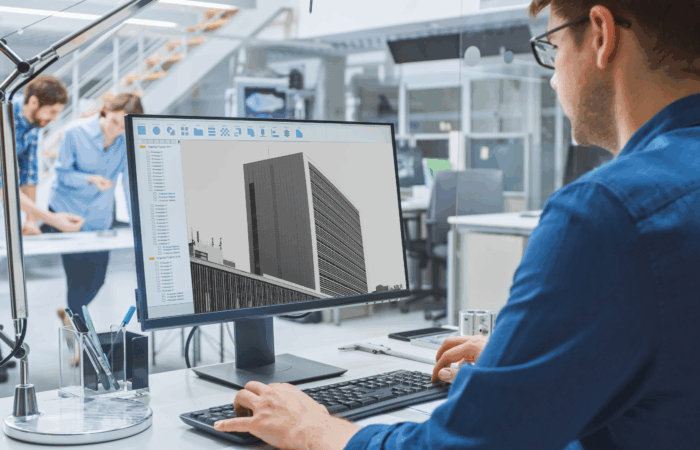 Equipo de arquitectos en un estudio moderno utilizando inteligencia artificial para optimizar el diseño de un proyecto arquitectónico